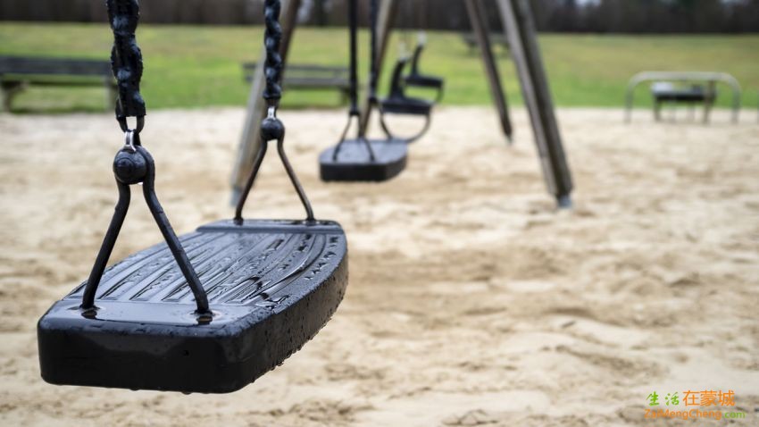 wet-swings-after-rain-on-a-deserted-playground-spring-day-on-a-dim-background-of.jpg